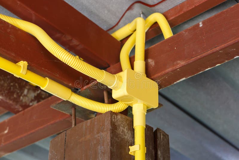 An yellow Electrical pipe installation. An yellow Electrical pipe installation