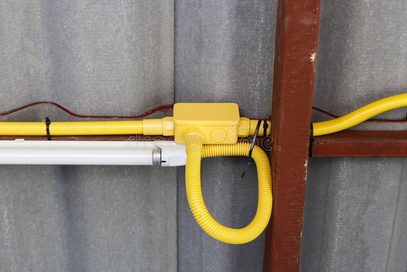 An yellow Electrical pipe installation. An yellow Electrical pipe installation