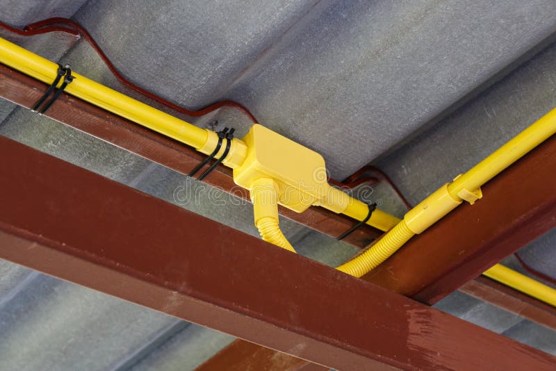 An yellow Electrical pipe installation. An yellow Electrical pipe installation