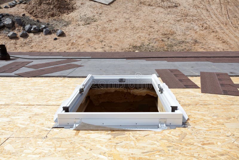 Installed Frame of New Plastic Mansardor Skylight Window on a Asphalt Shingle Roof. Stock Image