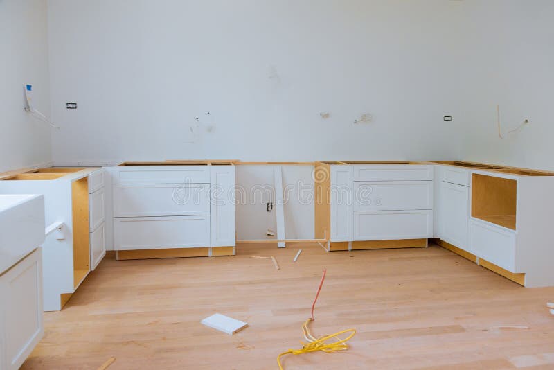 Installing Cabinets And Counter Top A White Kitchen Partially