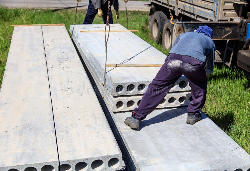 Installing Concrete Slabs at a Construction Site at Home Stock Photo
