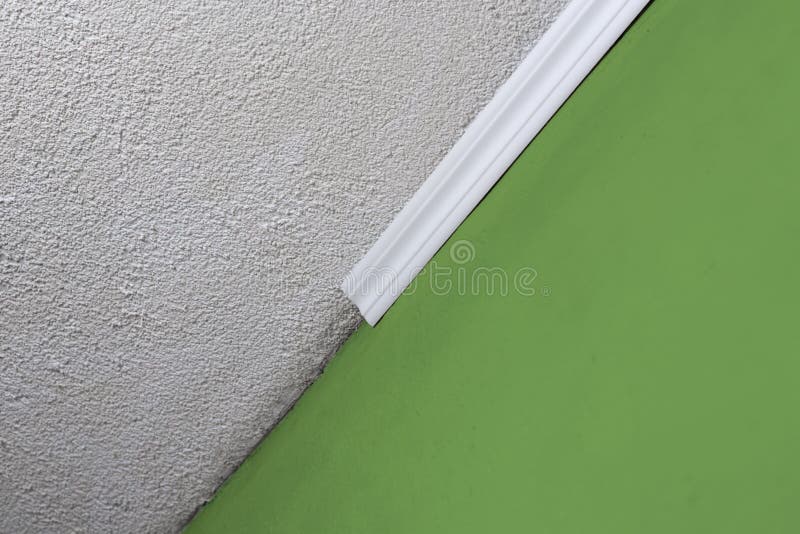 Installing Crown Molding On Ceiling In Room With Painted