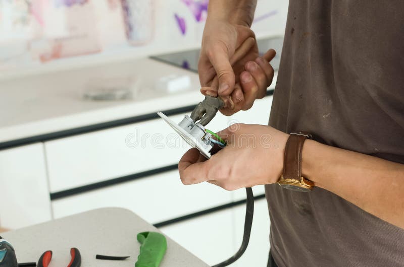 Installing an Electrical Outlet on a Kitchen Countertop Stock Photo Image of building, manual