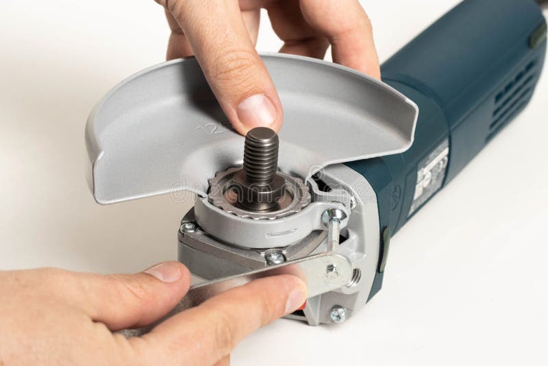 Installing the Safety Cover on an Angle Grinder, Closeup. Safety