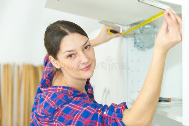 Installing Shelf Under Kitchen Cupboard Stock Photo Image of dish