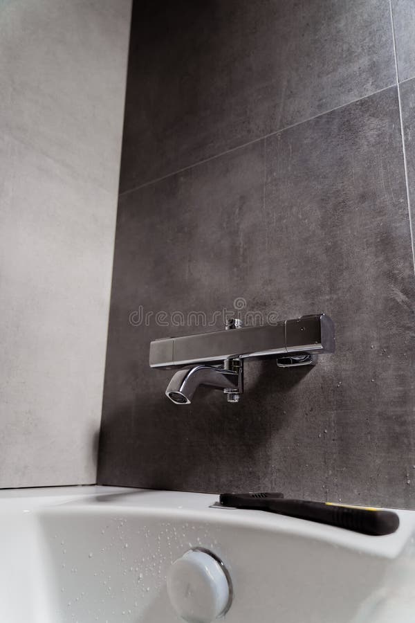 Installing a Shower Faucet in the Bathroom. an Adjustable Spanner Lies