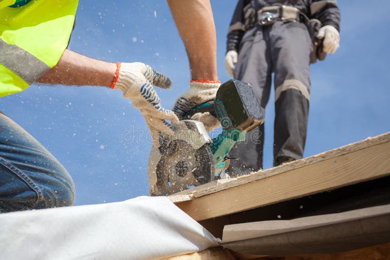 Installing a Skylight. Construction Builder Worker Use Circular Saw To