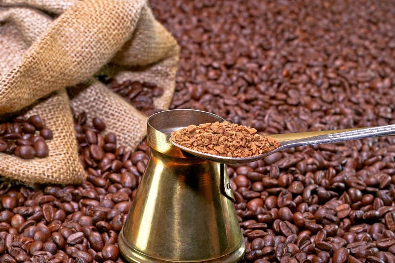 Instant coffee spoon with sack and coffee background