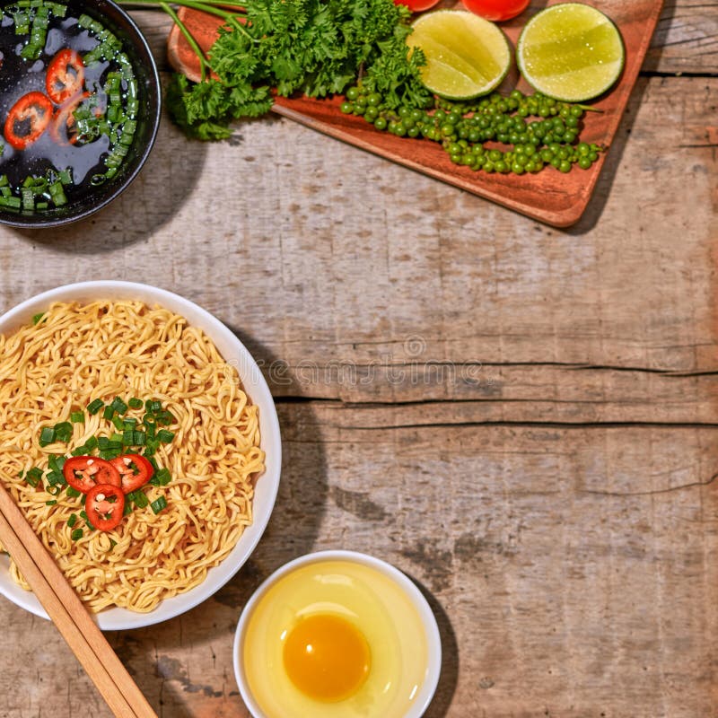Instant Noodle in Bowl Cooked Spicy Taste Topping with Eggs Stock Photo