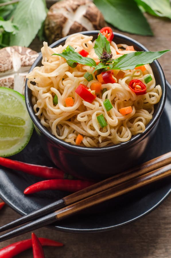 Instant Noodles in Black Bowl on Wooden Background Stock Image - Image ...