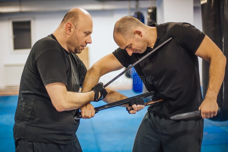 Instructor and Student Practice Long Sword and Knife Fighting Technique