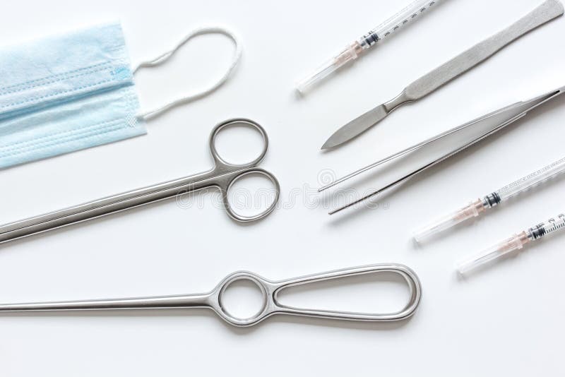 Instruments for Cosmetic Surgery on White Background Top View Stock