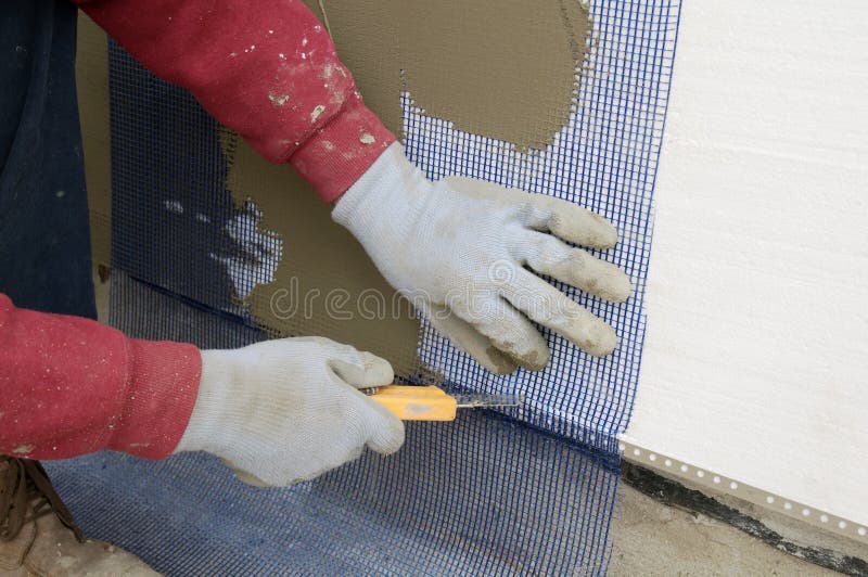 Close up of worker hands cut mesh on styrofoam insulation. Netting plastic stock images, royalty-free photos and pictures