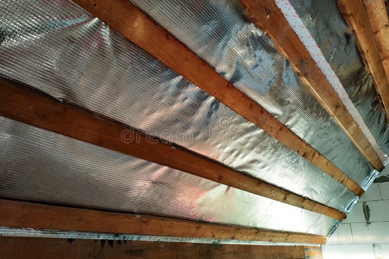 Insulation of the roof of the house on the inside with the use of a wrapper film and fixing boards