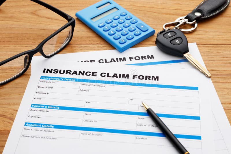 Insurance claim form with car key