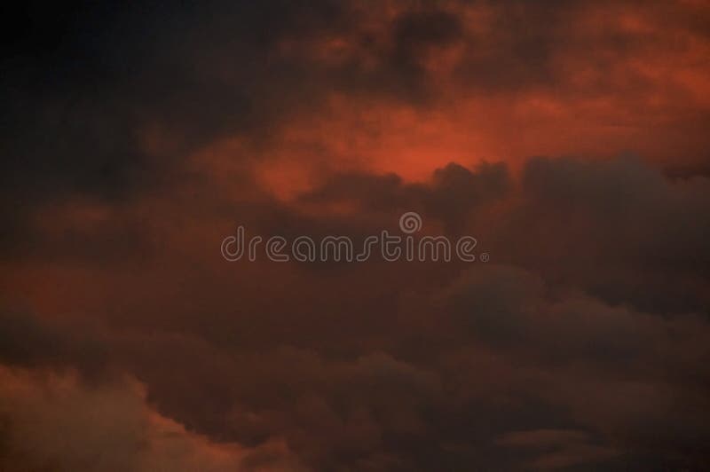 Intense colorful orange sunset cloudy sky