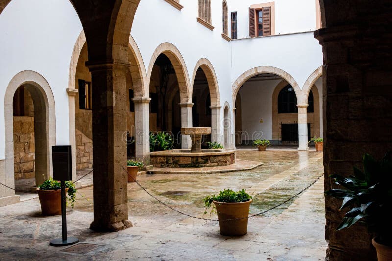 Interior of the Almudaina Palace in Spain. White Arched Walls