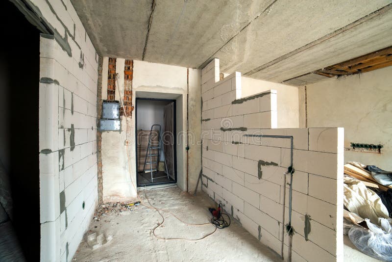 Interior of an Apartment Room with Bare Walls and Ceiling Under