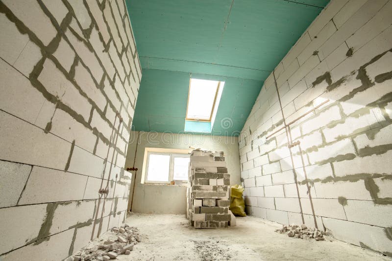 Interior of an Apartment Room with Bare Walls and Ceiling Under