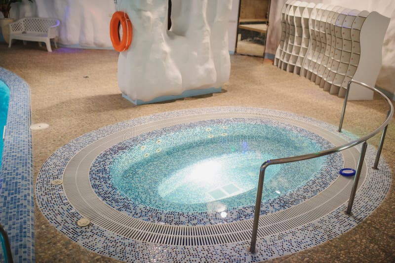The Aquazone in a Spa Salon, Swimming Pools and a Water Fall Stock