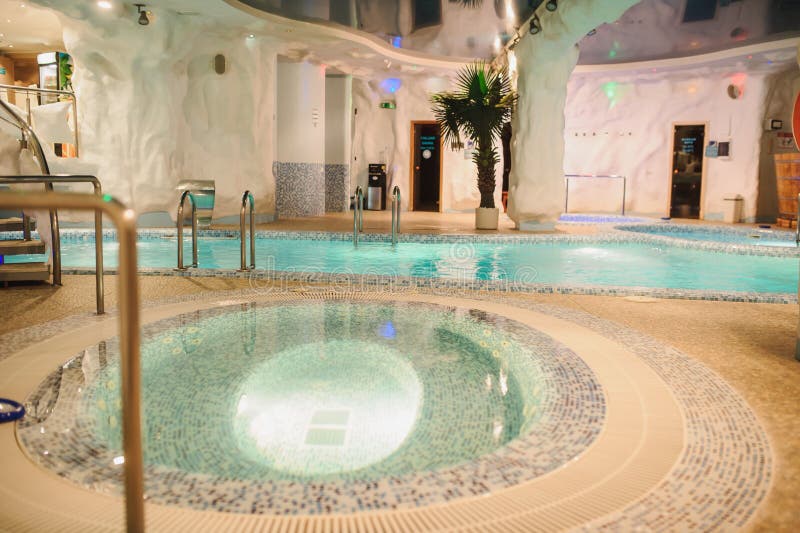 The Aquazone in a Spa Salon, Swimming Pools and a Water Fall Stock