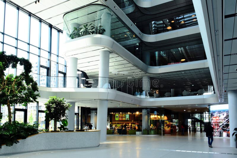 the interior atrium and lobby space of the MOL headquarter tower and campus in Budapest, Hungary