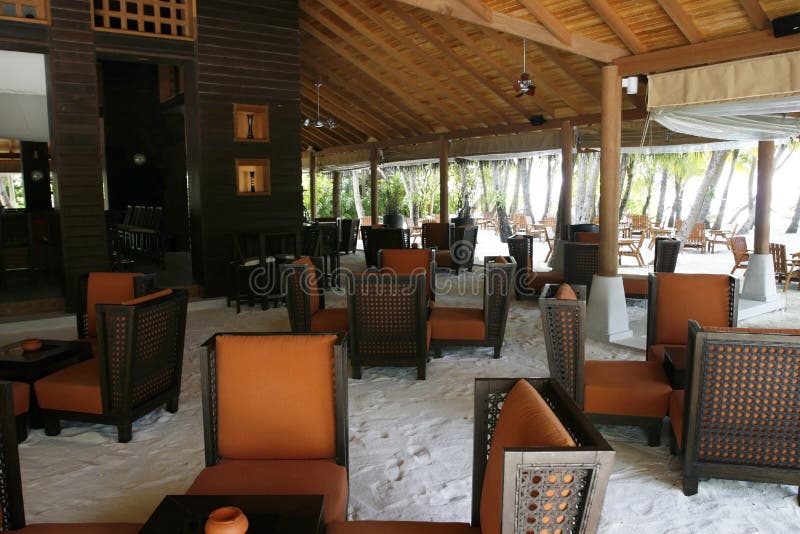 An interior view of a beach bar with the white sands as a ground. An interior view of a beach bar with the white sands as a ground.