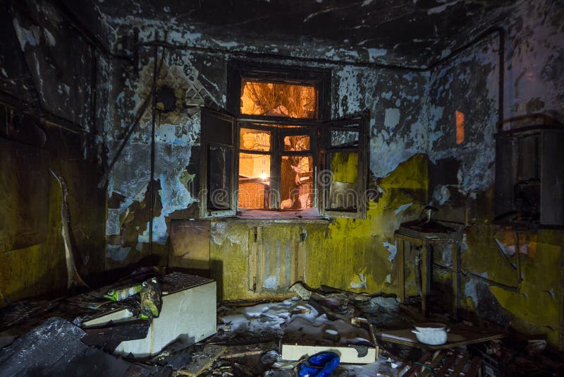 Interior of the Burned by Fire House, Burned Furniture Stock Photo