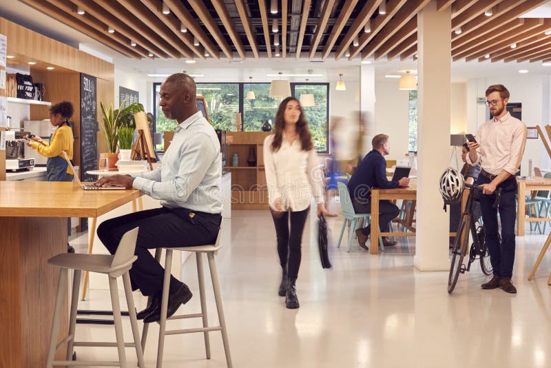 Interior of Busy Office Coffee Shop with Businesspeople Working at ...