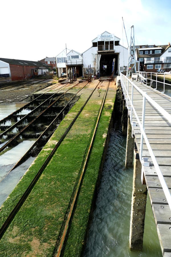 the interior of a boat repair yard, england. boats under