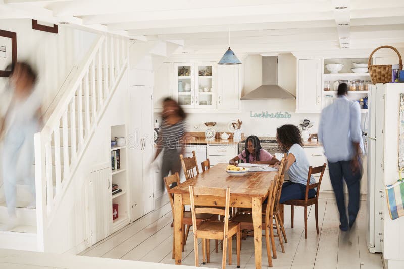 Interior Of Busy Family Home With Blurred Figures. Interior Of Busy Family Home With Blurred Figures
