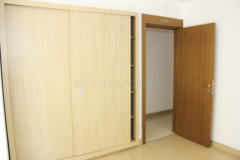 Interior Design of the Apartment with White Walls and Brown