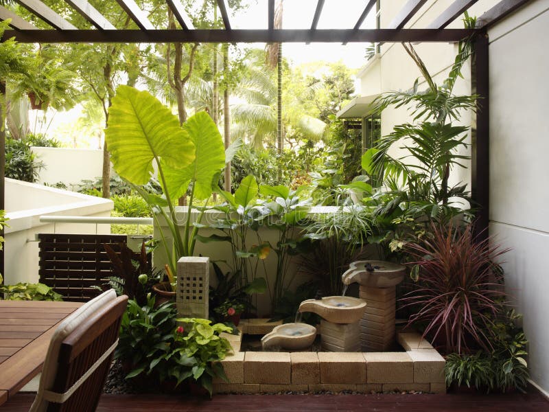 Interior design - garden. Exterior garden and pond at balcony royalty free stock photography