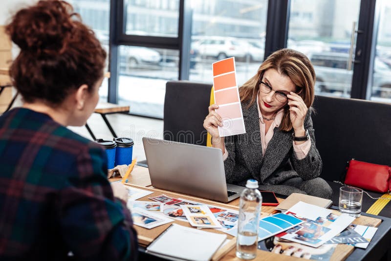 Interior designer feeling concerned about colors for new project royalty free stock image