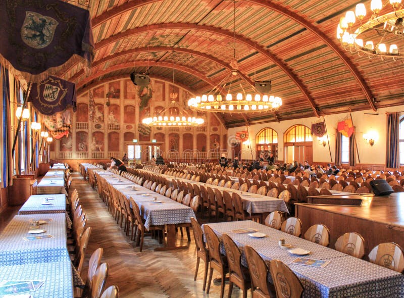 Interior of the HOFBRAUHAUS Beer house in Munich Germany with tables and chairs in rows