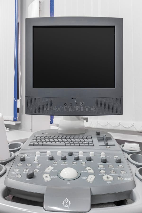Interior of Hospital Room with Ultrasound Machine and Bed Stock Image