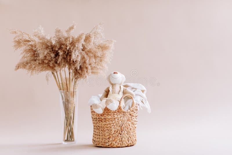 Natural home decor in wooden interior of bedroom. Bouquet of dried sticks  in vase and wicker basket at floor Stock Photo - Alamy