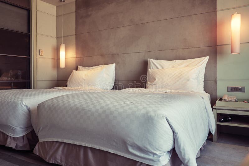 Interior image of hotel room with two beds inside