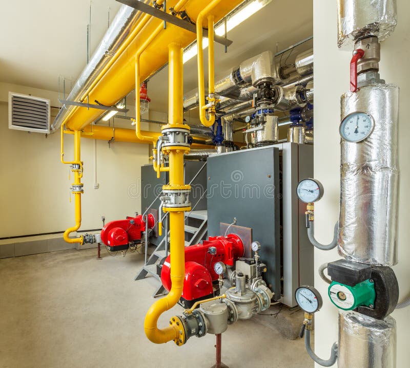 Interior of an industrial gas boiler room with boilers and pipelines stock photo