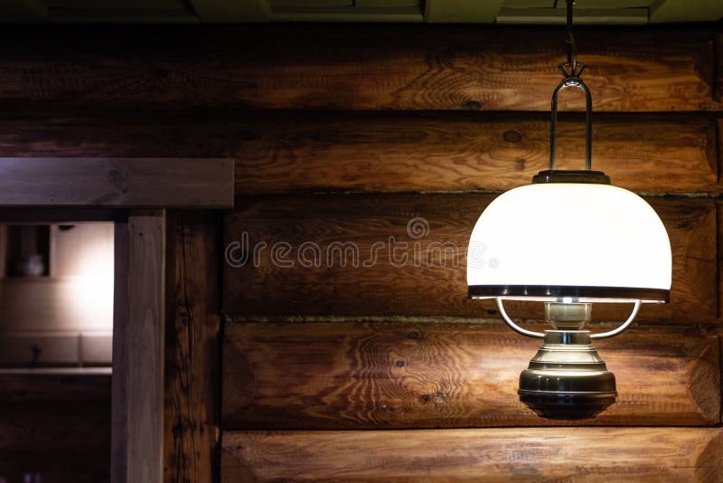 Interior of the log house with an electric lamp.