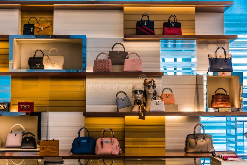Louis Vuitton bag show window display Singapore Orchard road modern fashion  luxury shopping mall shop store shops stores Stock Photo - Alamy