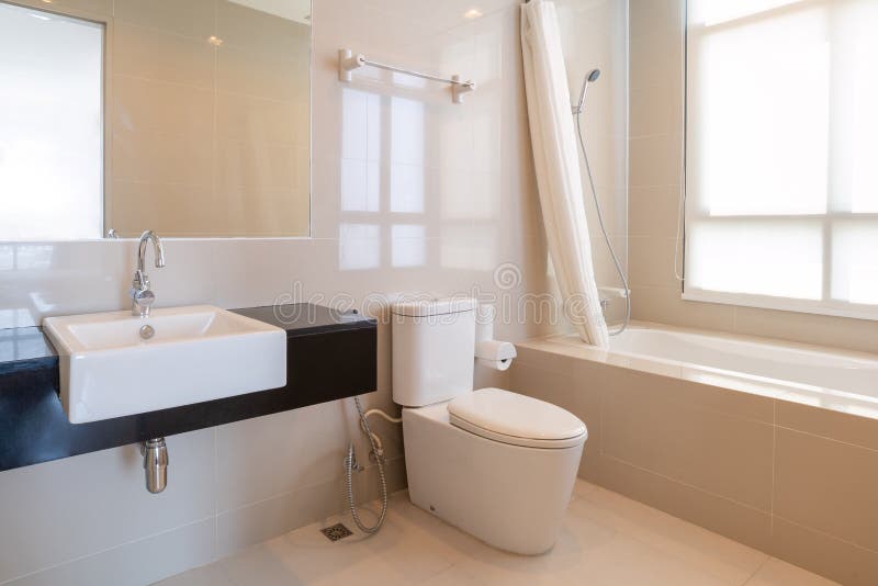 Cleaning Bathroom with Shower and Toilet in Modern House Stock Photo