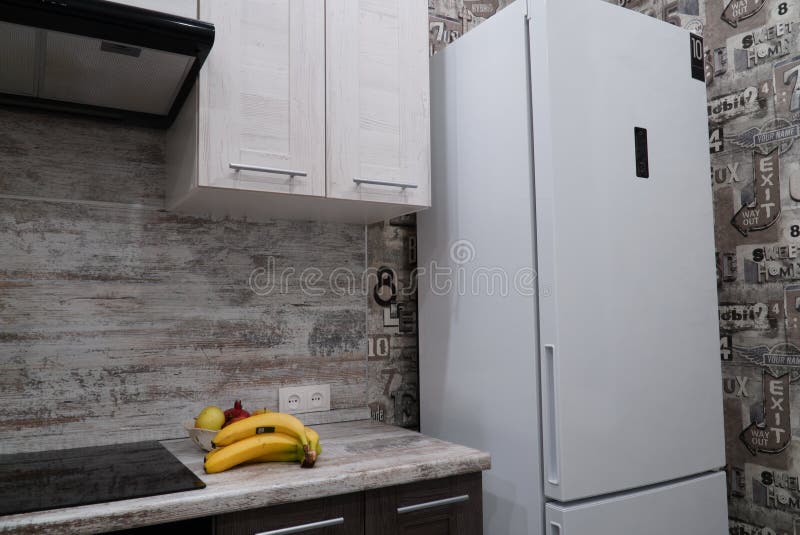 Interior of modern kitchen with refrigerator, refrigerator in the kitchen interior royalty free stock photography