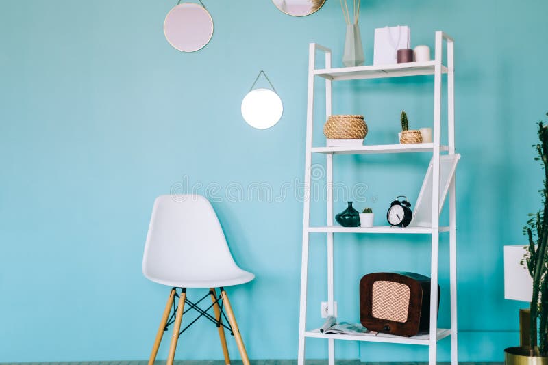 Interior of Modern Room White with Rack Shelving and Blue Walls Stock