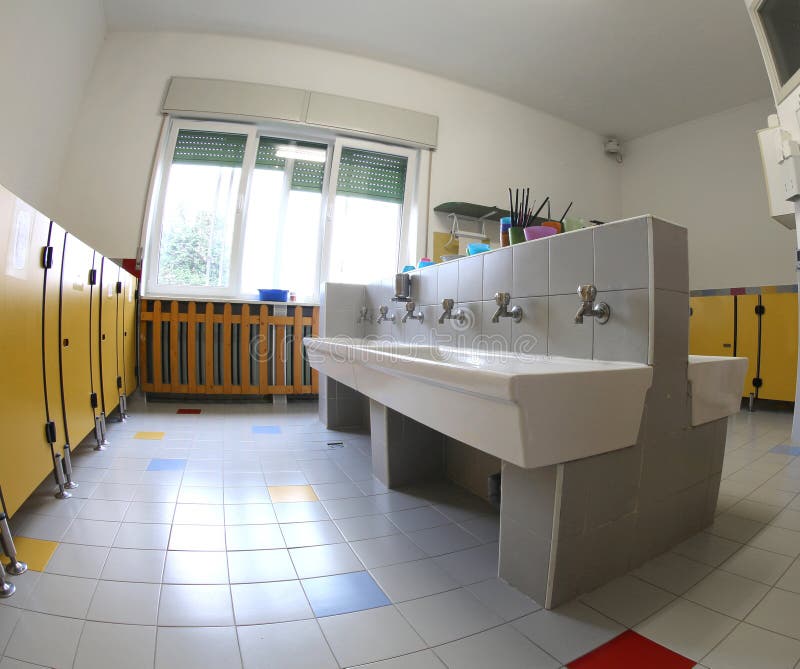 Bathrooms of a School for Children with Low Ceramic Sinks Stock Image