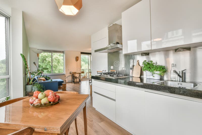 Interior Shot of a Dining Table Next To a Kitchen in a Nice House Stock Photo Image of decor