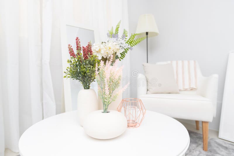 Interior View of Flower and Vase on White Table in Living Room Stock