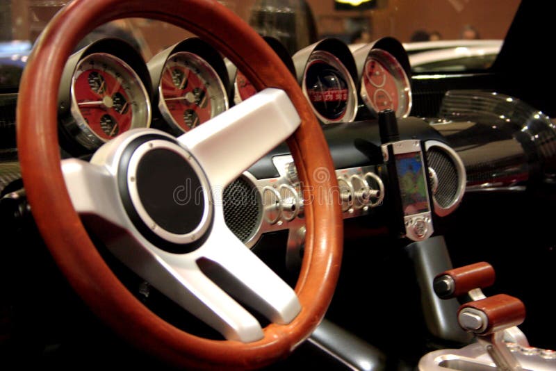 Inside view of a jeep, steering wheel and guages and gps. Inside view of a jeep, steering wheel and guages and gps