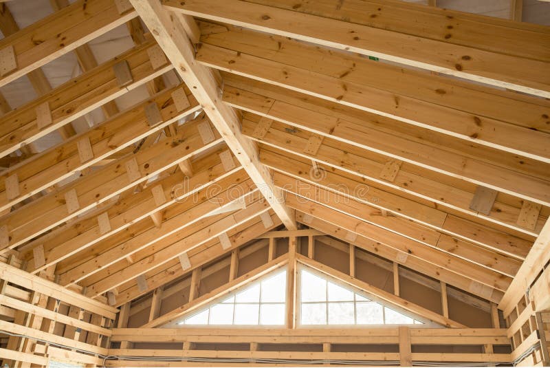 Interior view of a wooden roof structure. Construction of a wooden frame house
